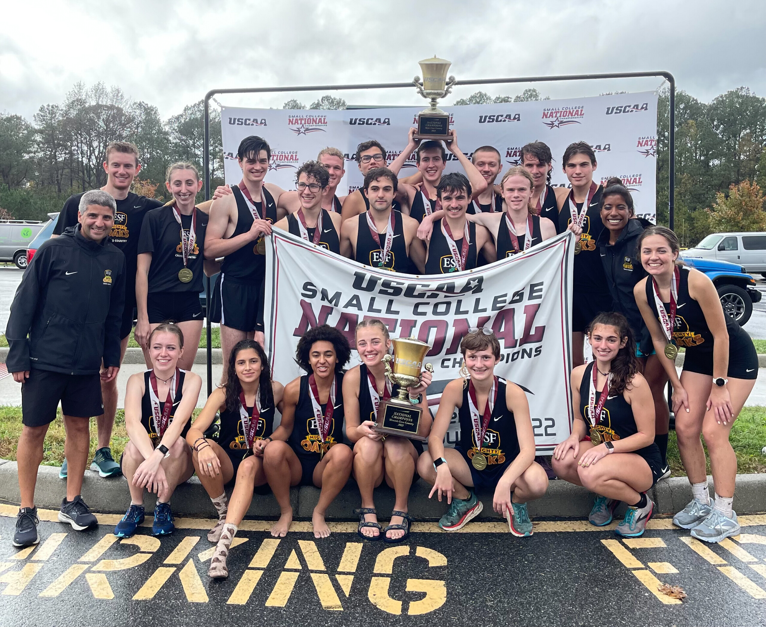 E S F cross country team with Coack Mike Melfi after wining USCAA national championship.